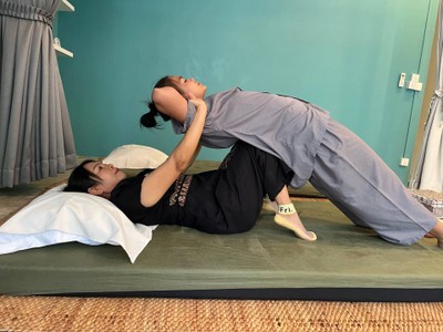 This pose helps stretch the muscles in the back waist area.