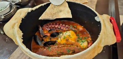Ligurian-style assorted seafood stew pot