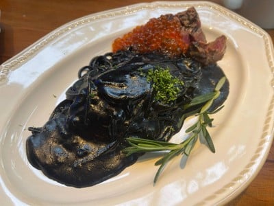 Grilled lamb with black ink pasta