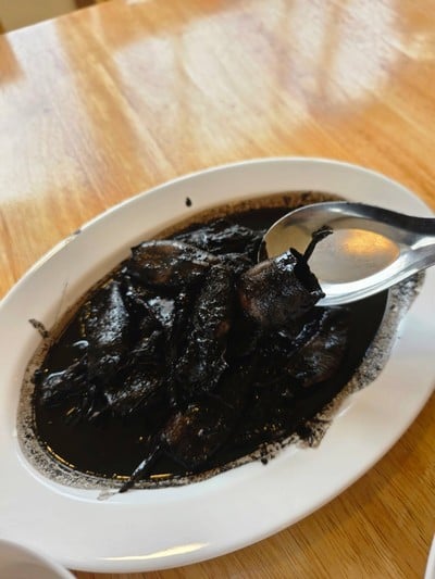 หมึกผัดน้ำดำ