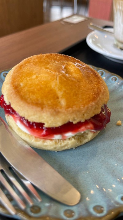 Scone with homemade jam and cream