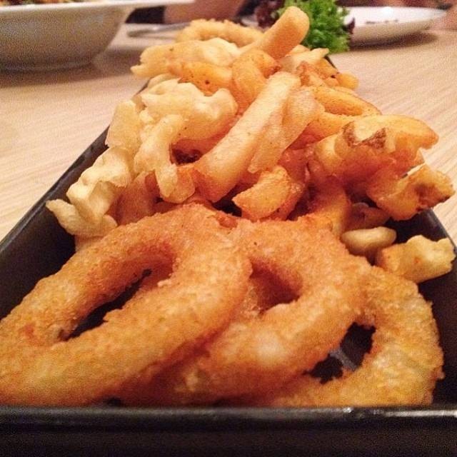 Calamari squid , onion ring , and spiral fries  