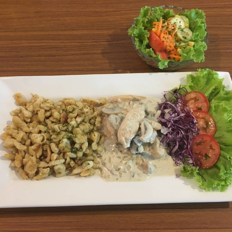 Chicken, cream sauce with mushrooms and spaetzle( home made egg noodles)