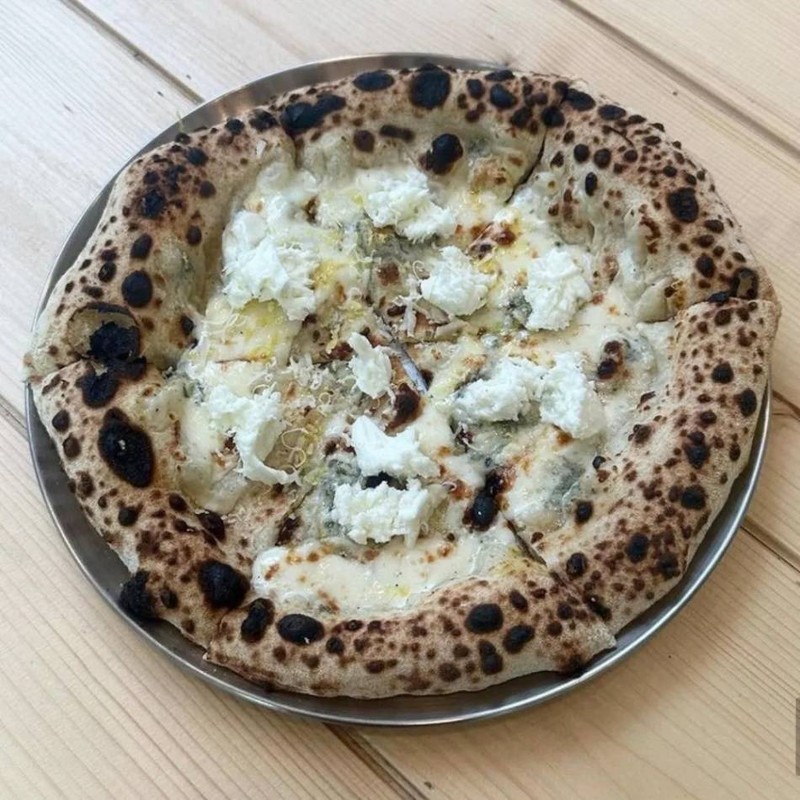 Four cheese pizza with lemon zest